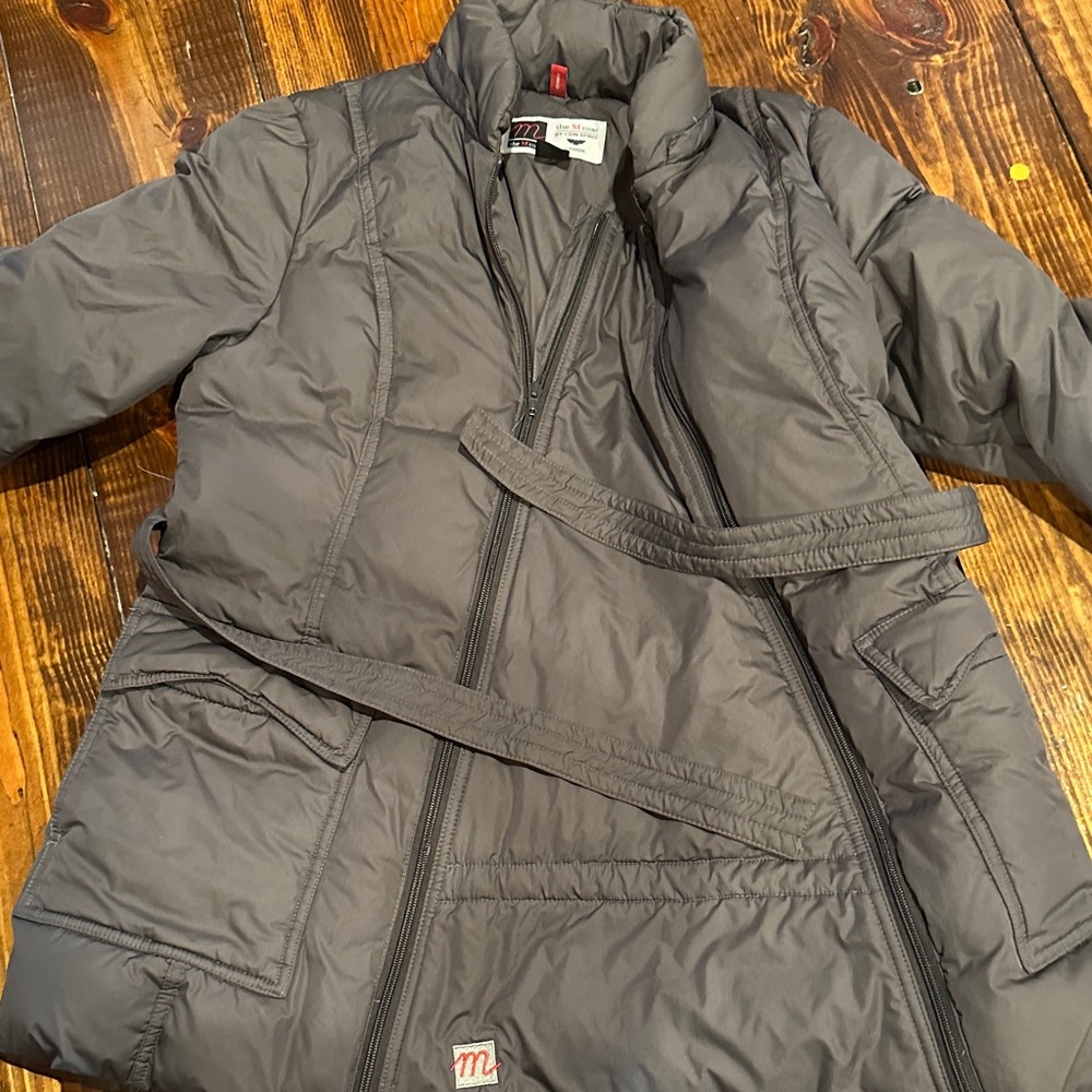 Belted gray maternity/baby wearing puffer coat
